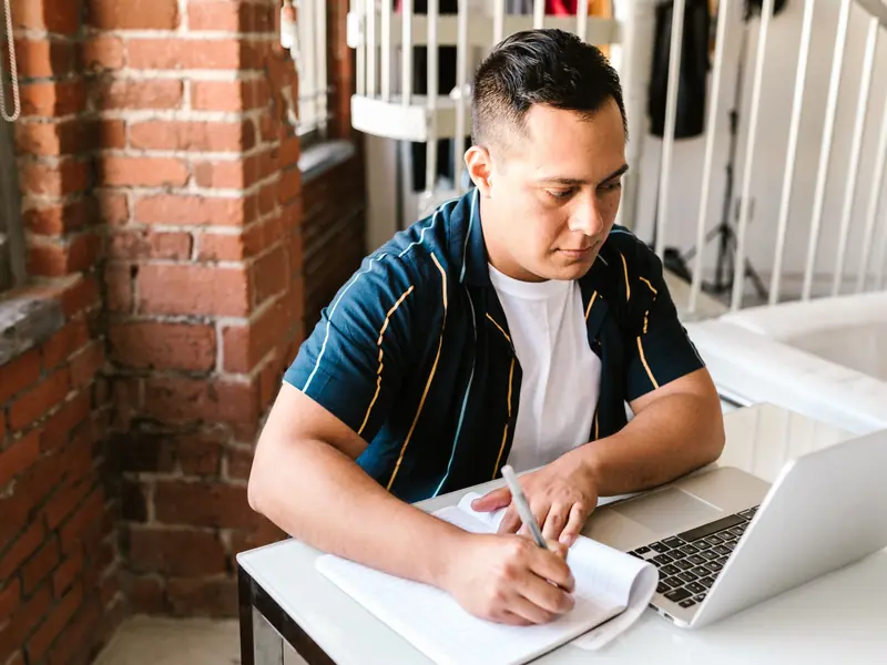 Adult learner studying for online qualifications with SJA Global Academia